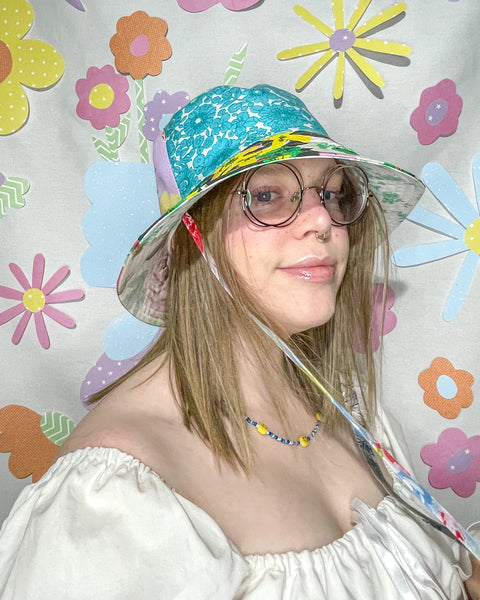 Young woman wearing the fantastic floral mismatched bucket hat
