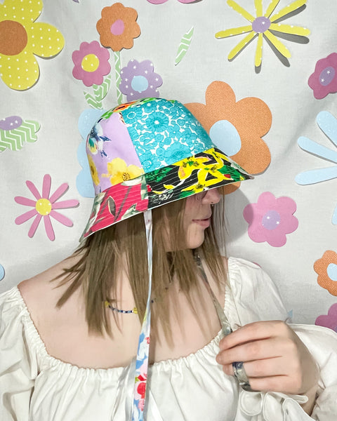 Young woman wearing the fantastic floral mismatched bucket hat