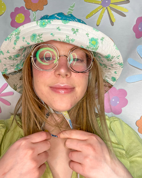 Young woman wearing the fantastic floral mismatched bucket hat