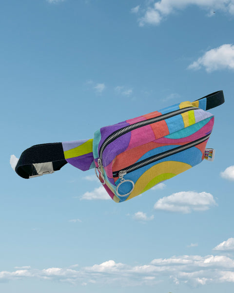 Rainbow swirl bumbag with black straps and zips