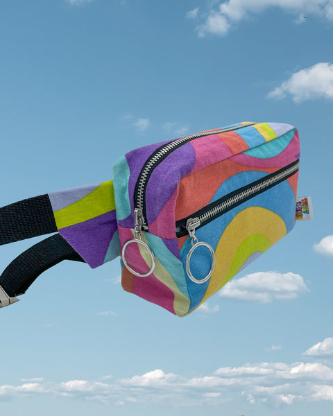 Rainbow swirl bumbag with black straps and zips