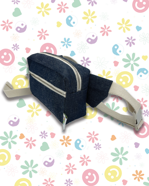 A dark navy blue fabric waist bag with a beige adjustable strap,