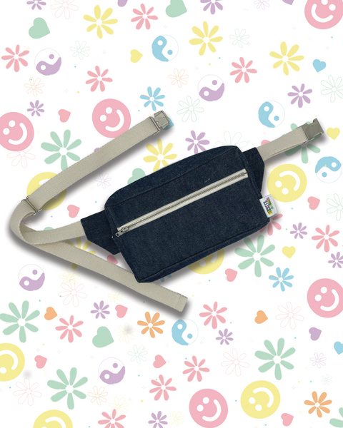 A dark denim waist bag with a light beige adjustable strap.