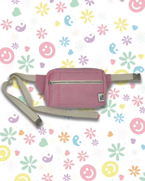 A pink denim waist pack bumbag with a beige adjustable strap and zippers. 