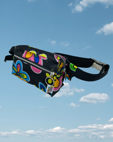 Product shot - black silky bumbag with large blue and pink neon flower pattern