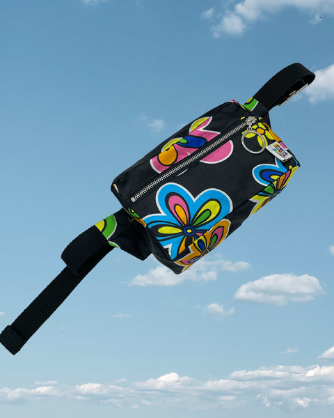 Product shot - silky black bumbag with large neon pink and blue flower pattern