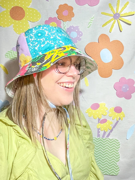 Young woman wearing the fantastic floral mismatched bucket hat 