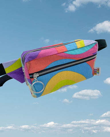 Rainbow swirl bumbag with black straps and zips